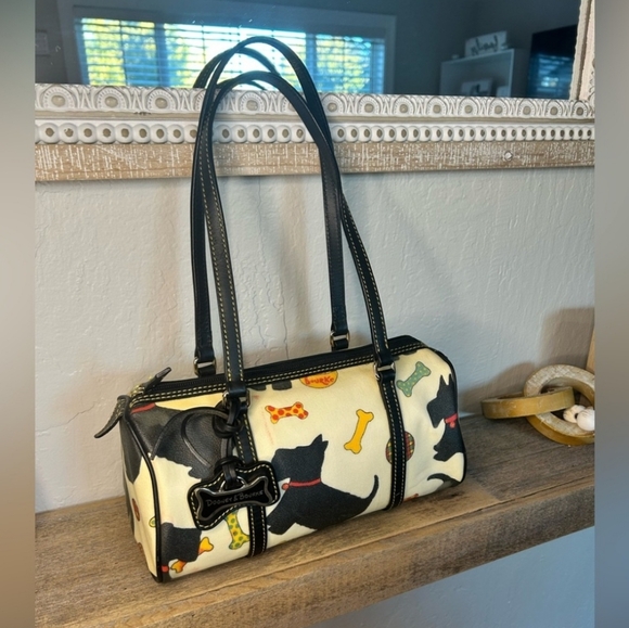 Dooney & Bourke Handbags - Vintage rare Dog Dooney with charm. Clean plaid interior